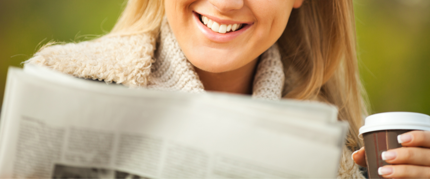 lady reading newspaper