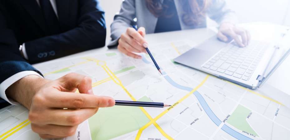 People viewing a map for development