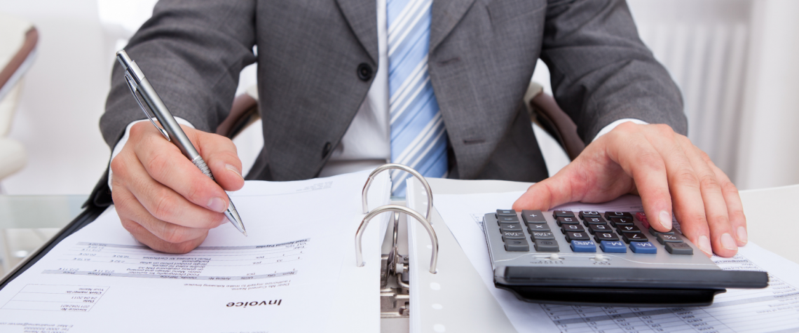 business man filling out payment paperwork